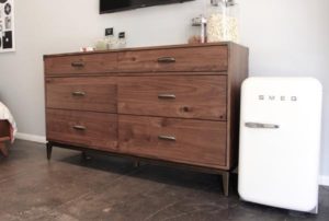 dresser with tv on wall different angle