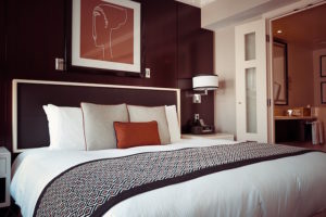 A dark accent wall helps bring out the other lighter tones