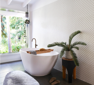 A minimalist bathroom is enhanced by jungle decor