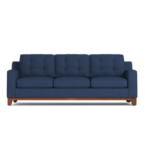 blue tufted sofa on white background
