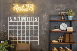 neon sign up against chalkboard