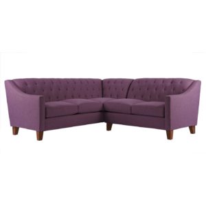 purple tufted sectional on white background