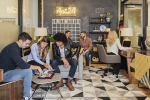 men and women working in fancy office