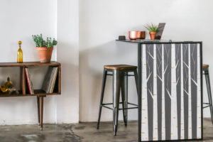 painting leaning against stools