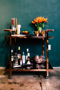bar cart with bottles of booze
