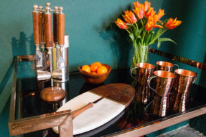 cocktail glasses and mugs on brown table