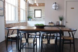wood dining table with black chairs